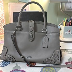 Brown coach purse floral detail